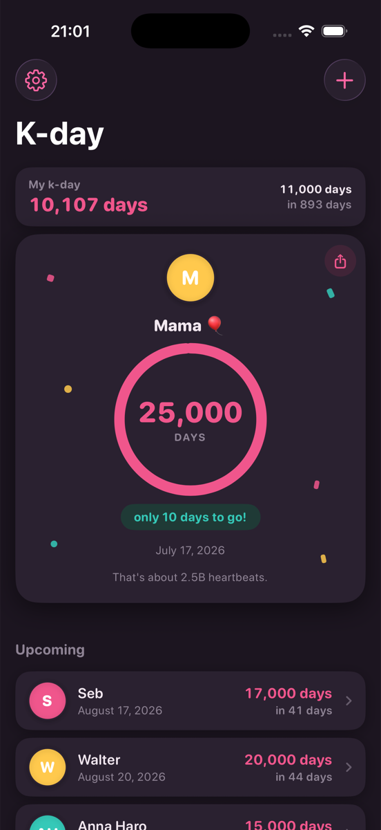 KDay in dark mode: deep plum background with a glowing pink milestone ring